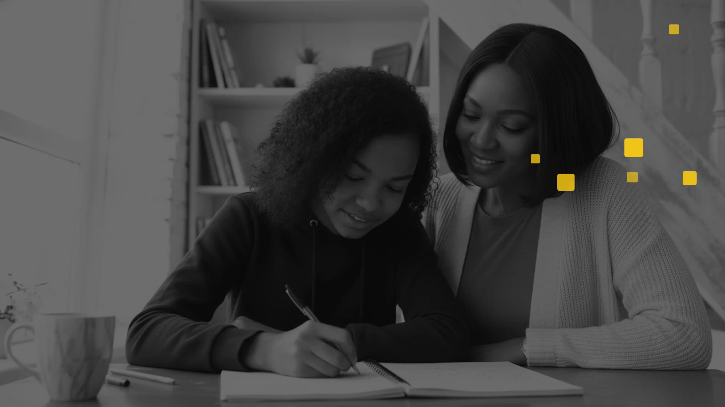 Younger student studying with a parent for admissions testing